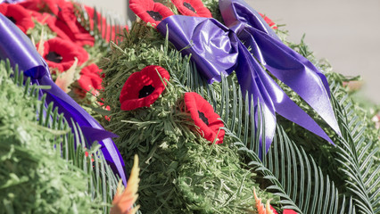 Remembrance day poppy wreath closeup, Halifax Nova Scotia Canada, no people, autumn sunshine.