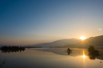 Sun Rising Behind the Hills