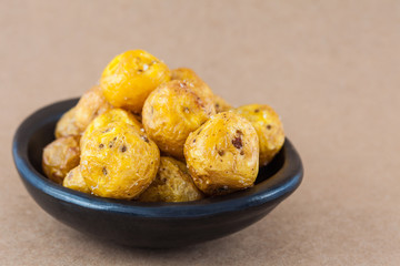 Fried yellow potato (Solanum phureja) isolated in beige background