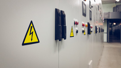 Sign dangerous voltage on the electrical panel.