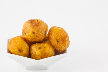 Fried yellow potato (Solanum phureja) isolated in white background