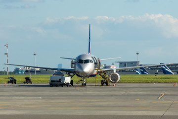 Fototapeta premium Commercial airplane parking at the airport