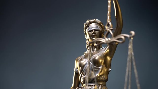 4k Lady Justice zoom in close up dolly shot - law concept shallow depth of field
