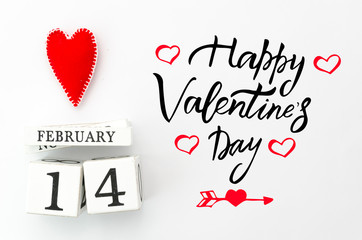 Happy valentines day lettering. White wood calendar with red heart on top Valentine's Day card....