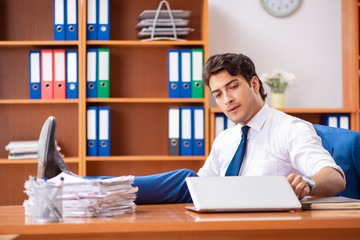 Fototapeta premium Young employee working in the office
