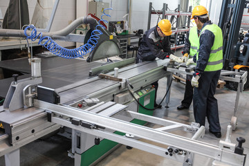 Workers at CNC machine shop