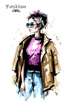 Hand drawn beautiful young woman in sunglasses. Stylish elegant girl outfit. Fashion woman portrait. Sketch.