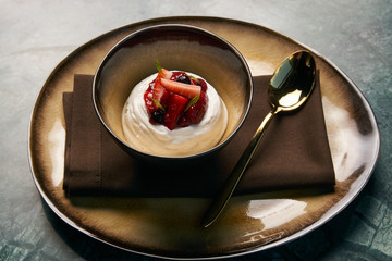 Ice cream with fresh strawberries, marshmallow, currants and min