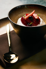 Ice cream with fresh strawberries, marshmallow, currants and min