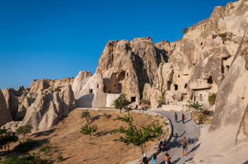 A detail from the structure of Cappadocia. Impressive fairy chimneys of sandstone in the canyon near Cavusin village, Cappadocia, Nevsehir Province in the Central Anatolia Region of Turkey. Clear sky.