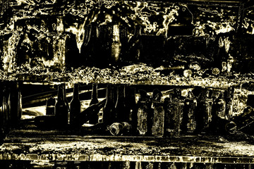 Naklejka premium Close up Burned damaged ruins of destroyed bottles supermarket arson investigation insurance