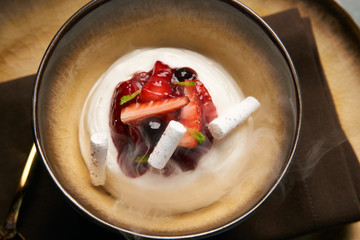 Cook chef making fruit ice cream added liquid nitrogen