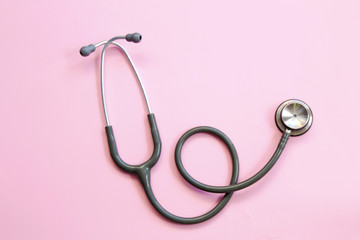 Medical concept. Stethoscope on the pink background.
