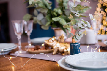 Christmas lights. Festive spirit. The pig is the symbol of the year.