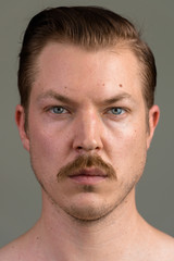 Obraz premium Face of young Caucasian man with mustache shirtless