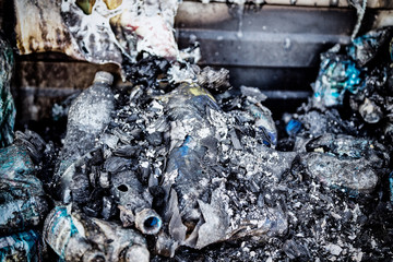 Close up Burned damaged ruins of destroyed bottles supermarket arson investigation insurance