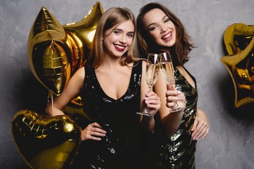 Party Fun. Beautiful Girls Celebrating New Year. Portrait Of Gorgeous Smiling Young Women Enjoying...