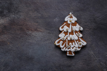 Gingerbread cookies tree on dark background, copyspace