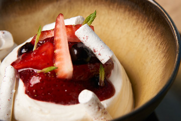 Estonian sweet dessert Kama with yoghurt mousse, wild berries an