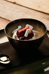 Ice cream dessert with fresh strawberries, marshmallow, currants