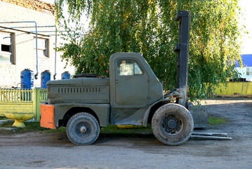 Old car loader. Side view.