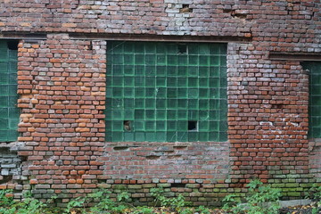 Fototapeta na wymiar the window is opaque, made of glass bricks. in a brick structure.