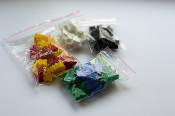 Groups of colorful meeples of two teams. Colors of ukrainian flag - blue and yellow. Small figures...