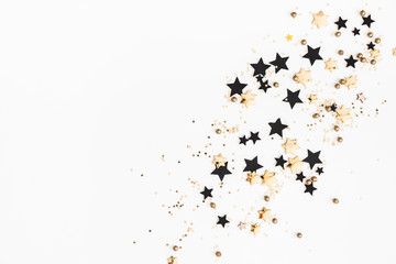 Christmas composition. Christmas golden and black decorations on white background. Flat lay, top view, copy space