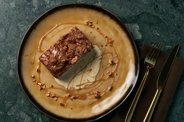 Plate with dessert , chocolate fondant lava cake with custard
