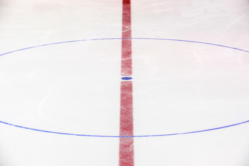 Face off blue spot with red line on hockey rink
