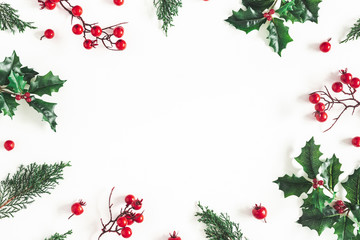 Christmas composition. Frame made of christmas plants on white background. Flat lay, top view, copy...