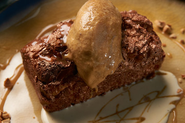 Close up of Chocolate cake with custard and pistachio ice cream