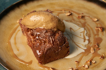 Close up of Chocolate cake with custard and pistachio ice cream
