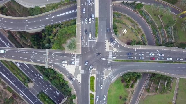 Multi level junction and Highway road with traffic on all levels - Top down Aerial time lapse