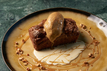 Delicious chocolate fondant lava cake with custard and pistachio