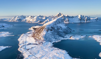 Aerial view on the mountains and sea bay on the Lofoten islands, Norway. Natural background in the Norway. Landscape from drone at the winter time