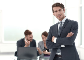 young businessman standing in the office