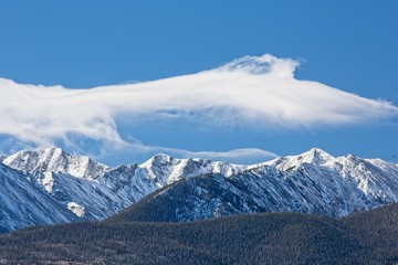 Fototapeta premium Snow capped mountains and clouds