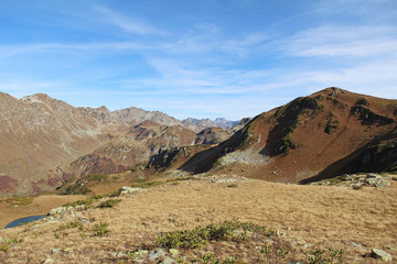Panorama with yellow autumn hills, lakes and mountains. Abkhazia.