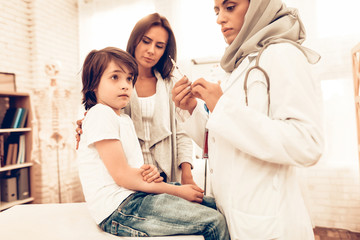 Arabic Female Doctor Hold Syringe with Injection