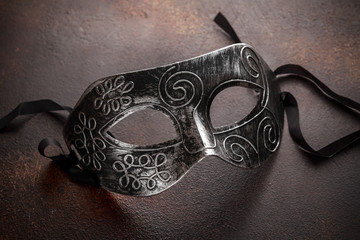 Carnival mask on a rusty background. Masquerade