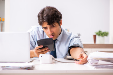 Fototapeta premium Man under stress measuring his blood pressure