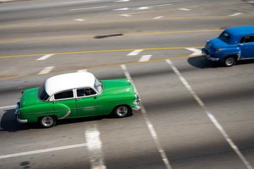 Fast Vintage american car in motion on the road