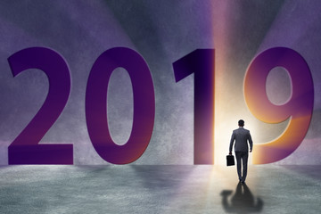 Fototapeta premium Businessman in the concept of transition to year 2019