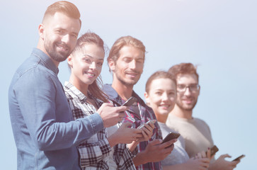 Fototapeta premium group of young people with modern smartphones.