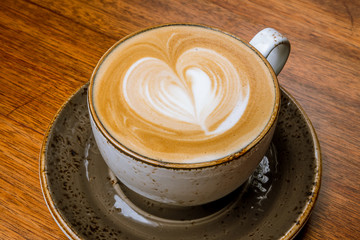Cappuccino coffee with heart drawing
