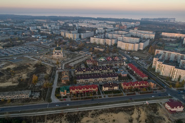 Fototapeta na wymiar Aerial view of town in autumn at sunset. Energodar, Ukraine. The satellite city of Europe's most atomic power station. Aerial photography. Top view.