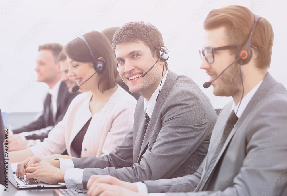 Sticker employee call center with headset at workplace