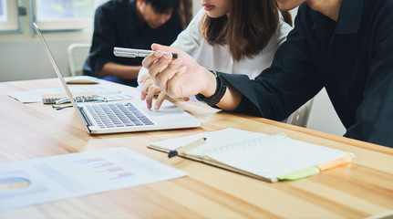 teamwork, Young businesswoman in office in casual shirt. Selecting information with colleagues with a computer. Business Marketing Planning.