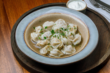Dumplings with sour cream and herbs